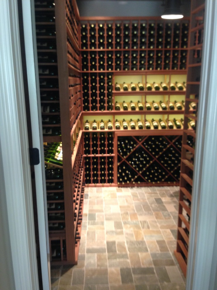 Mid-sized traditional wine cellar in Orange County with display racks.