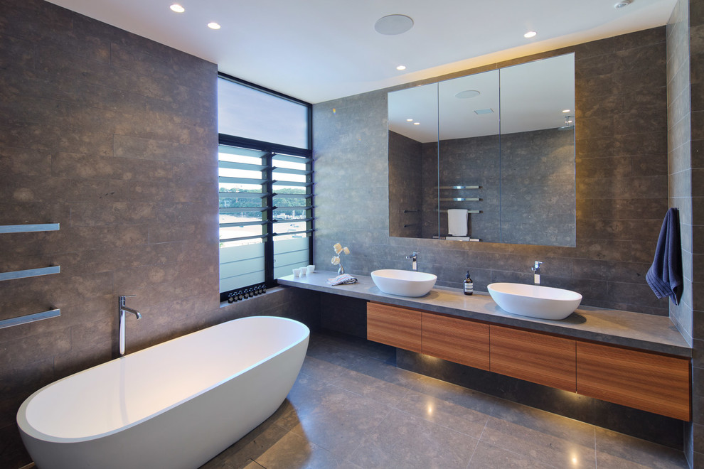 Large contemporary master bathroom in Sydney with flat-panel cabinets and medium wood cabinets.