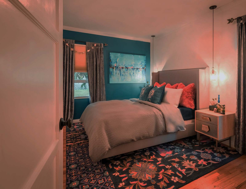 Photo of a mid-sized eclectic bedroom in Los Angeles with beige walls, medium hardwood floors and beige floor.