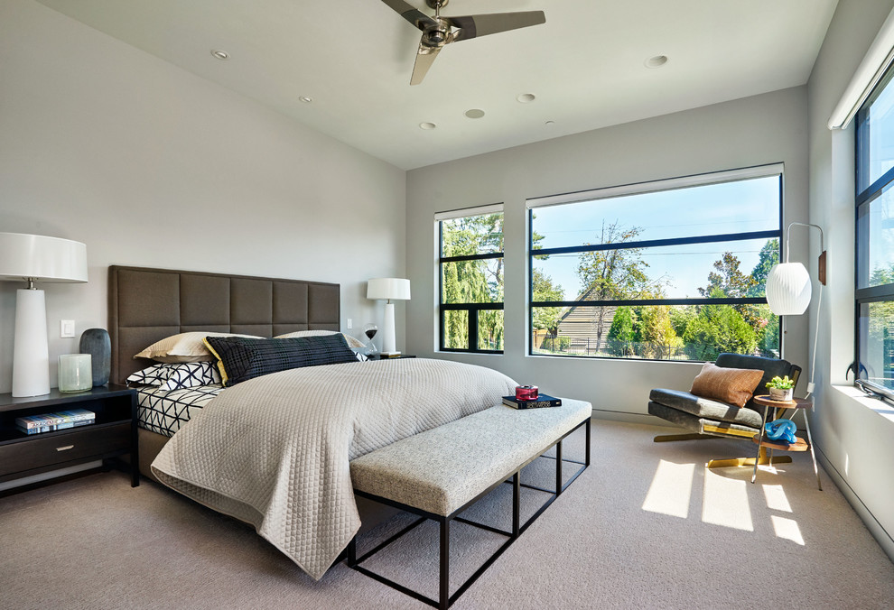 Contemporary bedroom in Portland with grey walls and carpet.