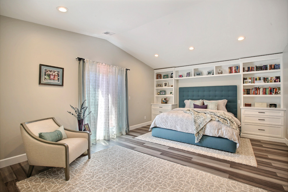 This is an example of a mid-sized transitional master bedroom in Other with white walls, bamboo floors and grey floor.