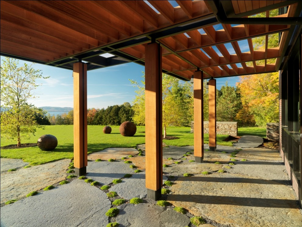 Inspiration for a country patio in Burlington with a pergola.
