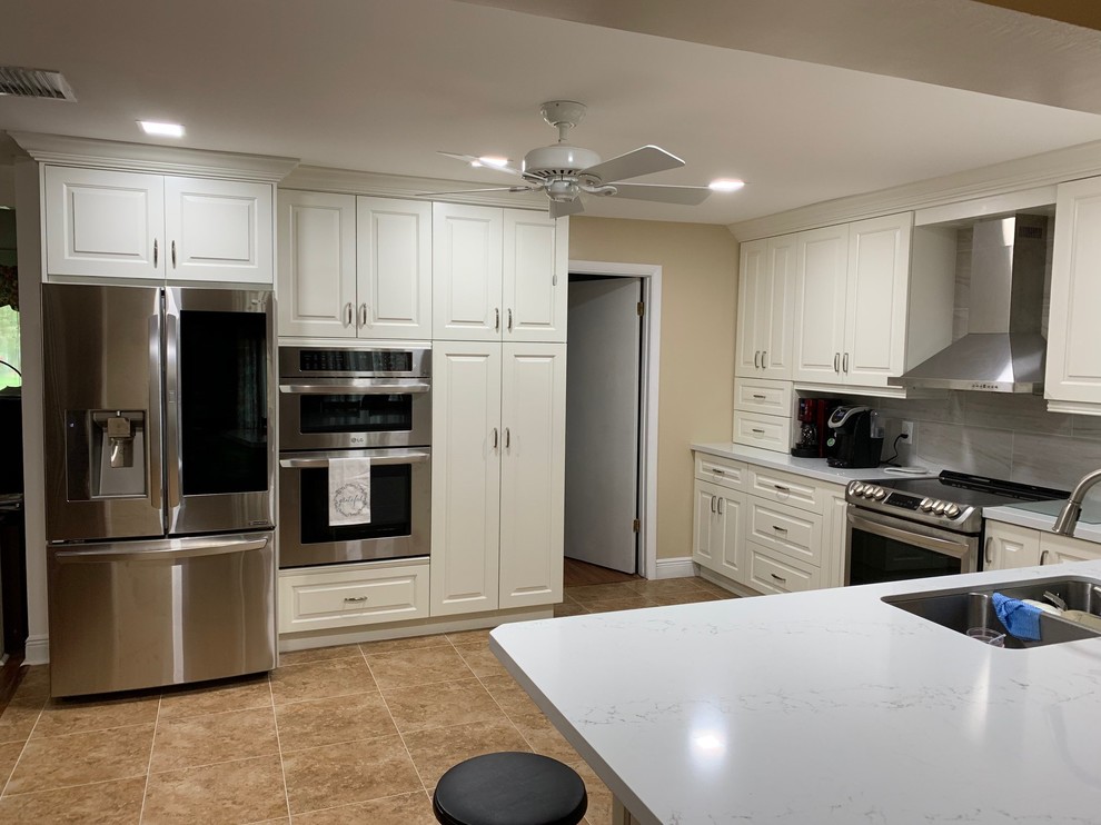 Example of a transitional kitchen design in Miami