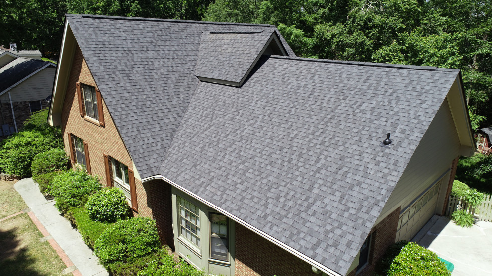 Photo of a large house exterior in Atlanta with a gable roof and a shingle roof.