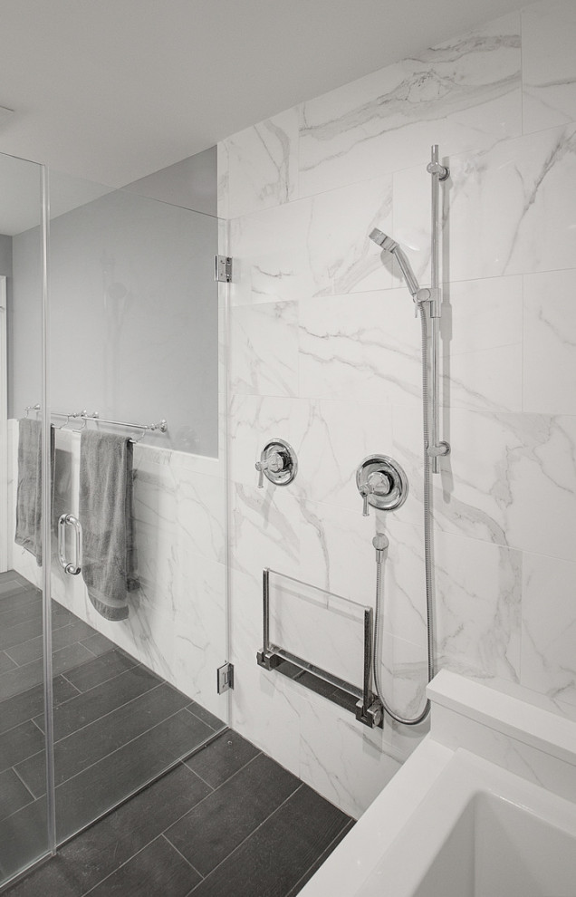 Inspiration for a large transitional white tile and porcelain tile porcelain tile, gray floor and single-sink drop-in bathtub remodel with recessed-panel cabinets, white cabinets, a two-piece toilet, gray walls, an undermount sink, quartz countertops, a hinged shower door, gray countertops, a niche and a built-in vanity