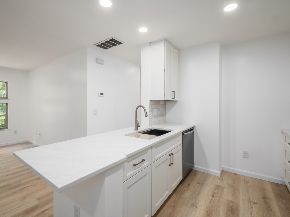 Small transitional galley eat-in kitchen photo in Columbus with shaker cabinets, white cabinets, quartz countertops and white countertops