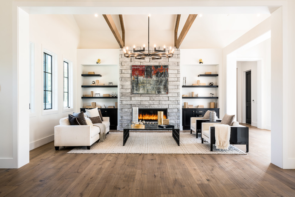 Contemporary formal open concept living room in Los Angeles with white walls, medium hardwood floors, a ribbon fireplace, a stone fireplace surround, no tv and brown floor.