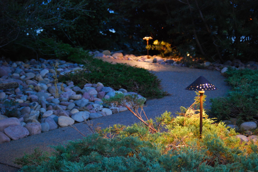 Photo of a mid-sized rustic front yard concrete paver garden path in Calgary.