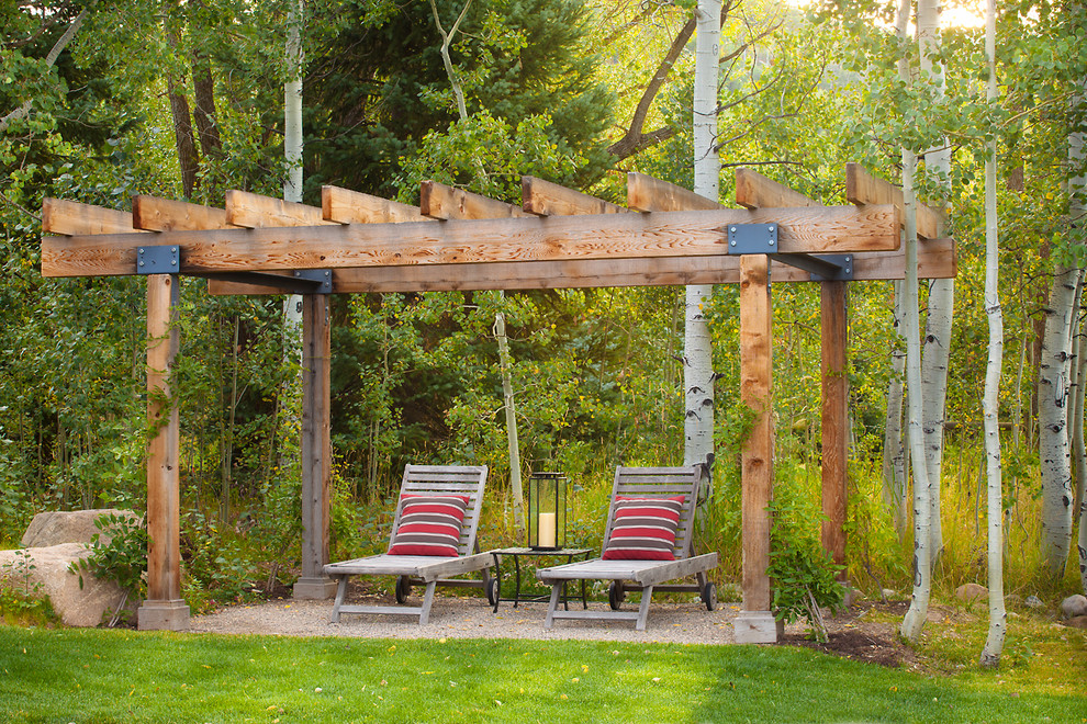 Inspiration for a country patio in Denver with a pergola.