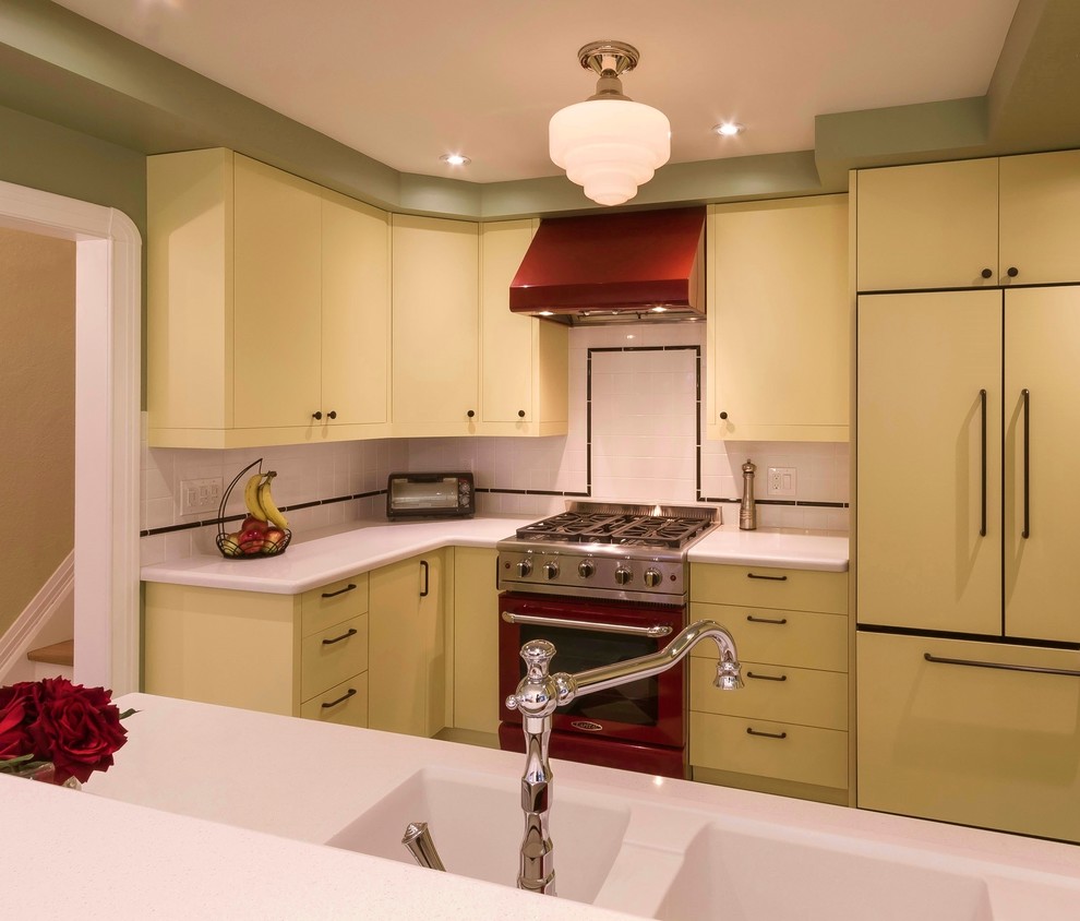 Small midcentury u-shaped separate kitchen in Toronto with an integrated sink, flat-panel cabinets, yellow cabinets, solid surface benchtops, white splashback, ceramic splashback, coloured appliances and no island.