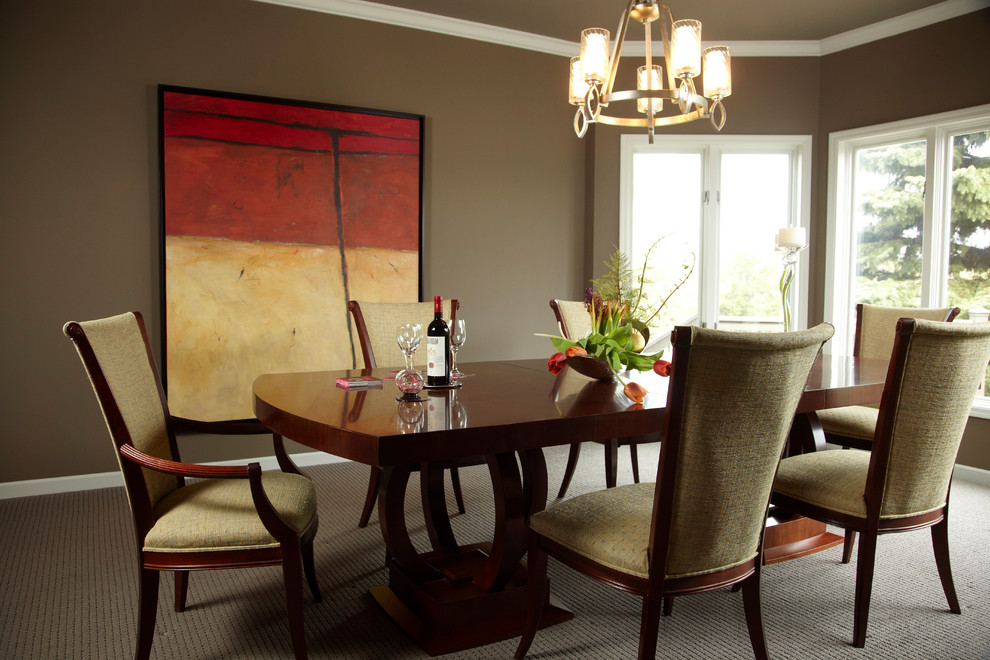 Traditional dining room in Minneapolis with brown walls and carpet.