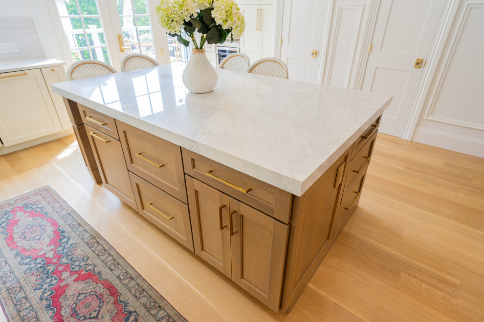 Transitional kitchen photo with recessed-panel cabinets and white cabinets