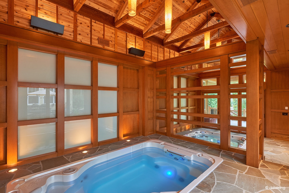 Pool house - large transitional indoor rectangular lap pool house idea in Seattle