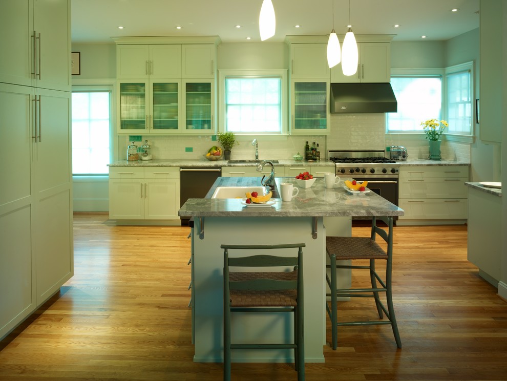 Inspiration for a mid-sized transitional u-shaped enclosed kitchen remodel in Raleigh with recessed-panel cabinets, green cabinets, marble countertops, stainless steel appliances and an island