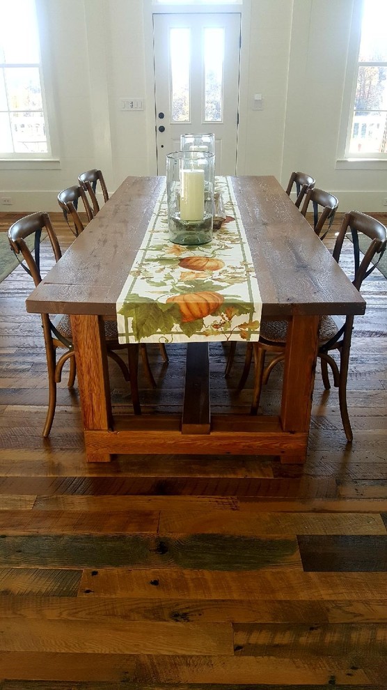 This is an example of a country dining room in Other.