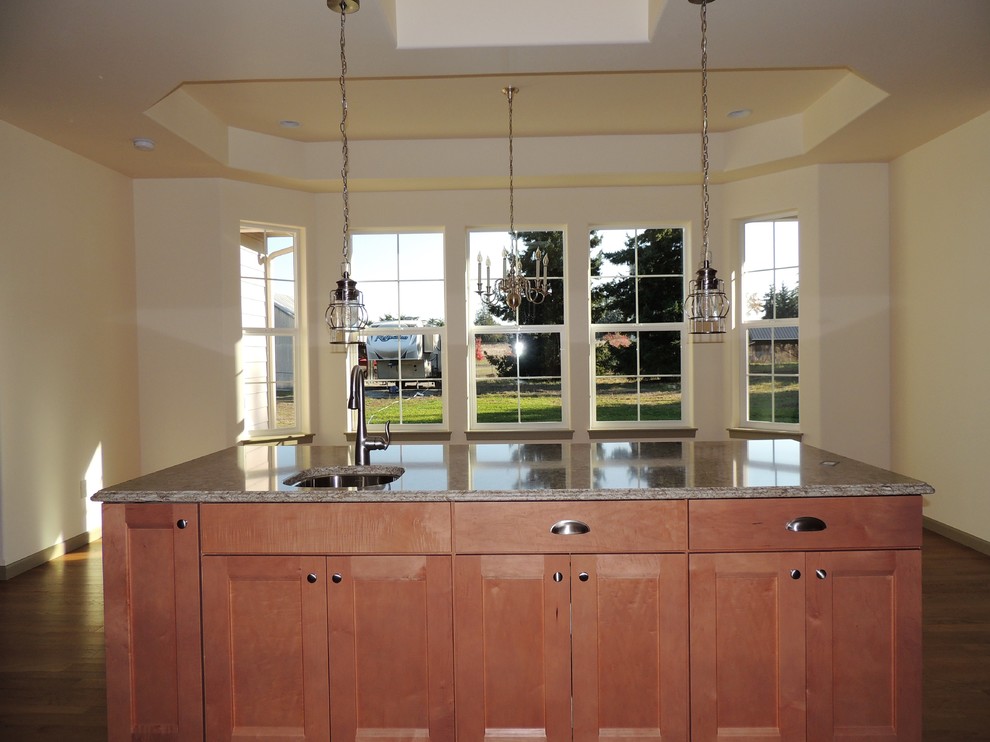 Large transitional u-shaped light wood floor eat-in kitchen photo in Seattle with recessed-panel cabinets, medium tone wood cabinets, multicolored backsplash, mosaic tile backsplash, stainless steel appliances, an island and quartz countertops