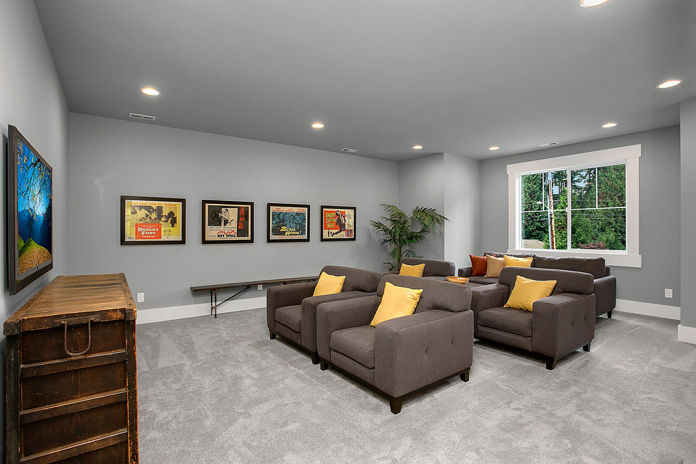 Inspiration for a traditional enclosed home theatre in Seattle with grey walls, carpet, a wall-mounted tv and grey floor.