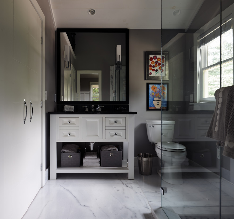 Example of a small transitional master white tile and stone slab marble floor bathroom design with recessed-panel cabinets, white cabinets, a one-piece toilet, gray walls, an undermount sink and granite countertops