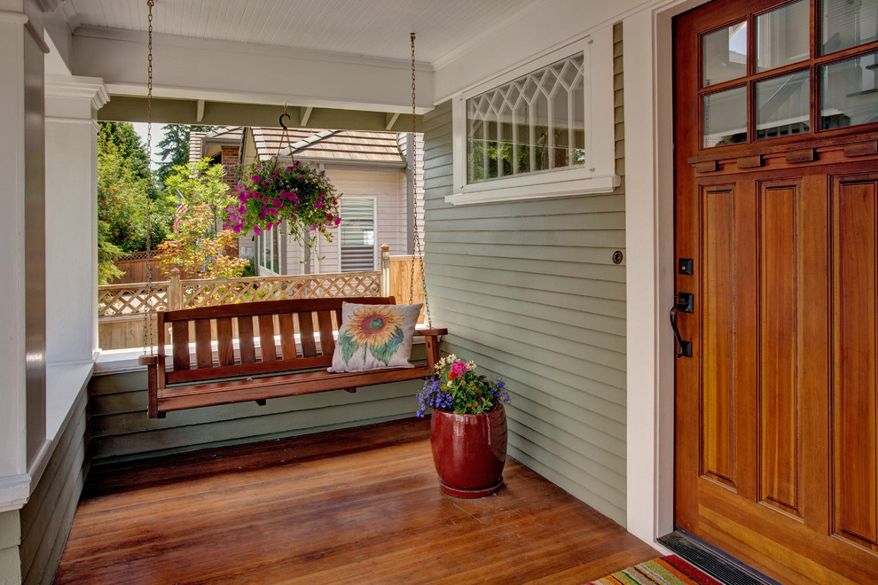 Design ideas for an arts and crafts verandah in Seattle with decking and a roof extension.