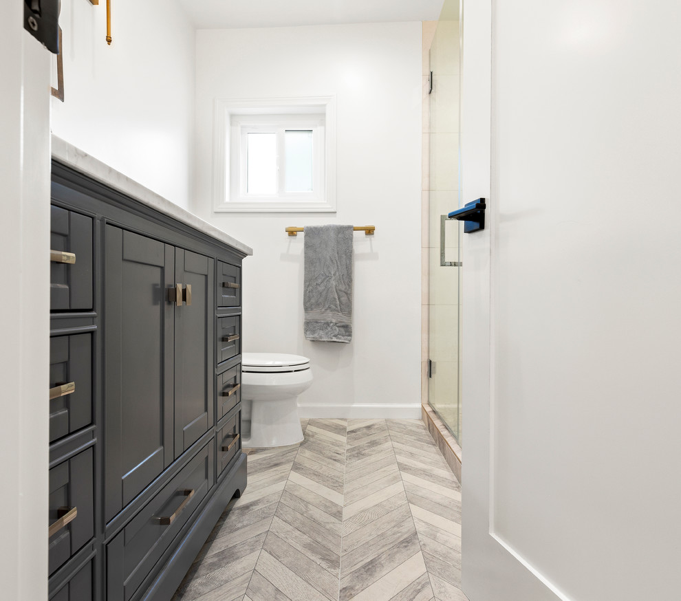 Photo of a small transitional master bathroom in Los Angeles with shaker cabinets, grey cabinets, beige tile, porcelain tile, white walls, porcelain floors, multi-coloured floor and white benchtops.