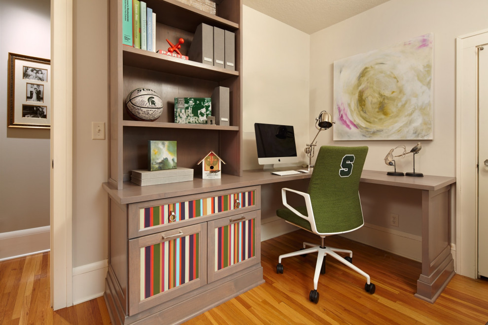 Medium sized classic study in Minneapolis with medium hardwood flooring and brown floors.