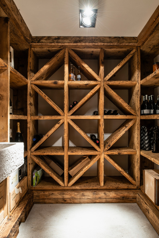This is an example of a small country wine cellar with limestone floors and display racks.