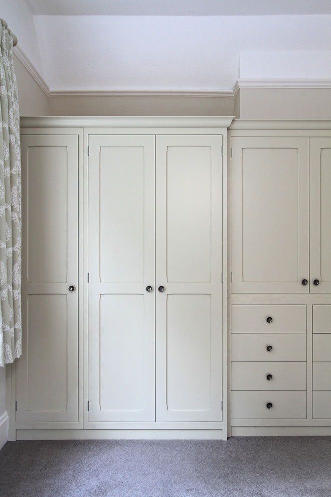 This is an example of a large traditional storage and wardrobe in Hampshire with carpet.