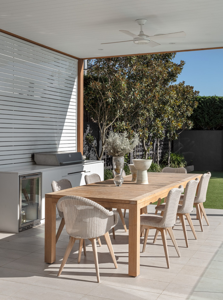 This is an example of a large contemporary backyard patio in Sydney.
