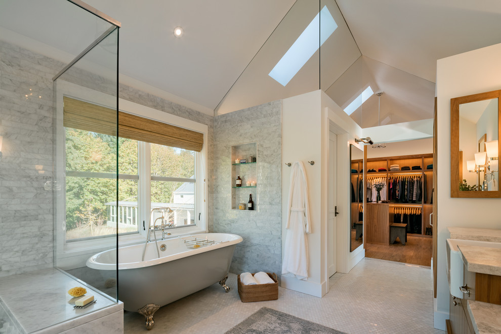 Photo of a large country master bathroom in Other with a claw-foot tub, white walls, mosaic tile floors, white floor, a corner shower, gray tile, marble, marble benchtops, a hinged shower door, dark wood cabinets and flat-panel cabinets.