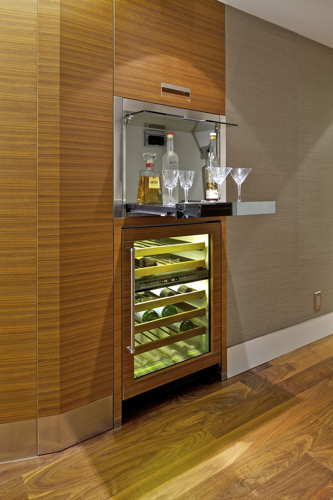 Inspiration for a small contemporary single-wall wet bar in San Diego with no sink, flat-panel cabinets, light wood cabinets, dark hardwood floors and brown floor.
