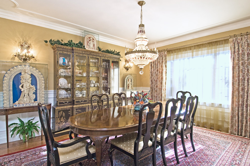 Inspiration for a traditional dining room in Other with beige walls.