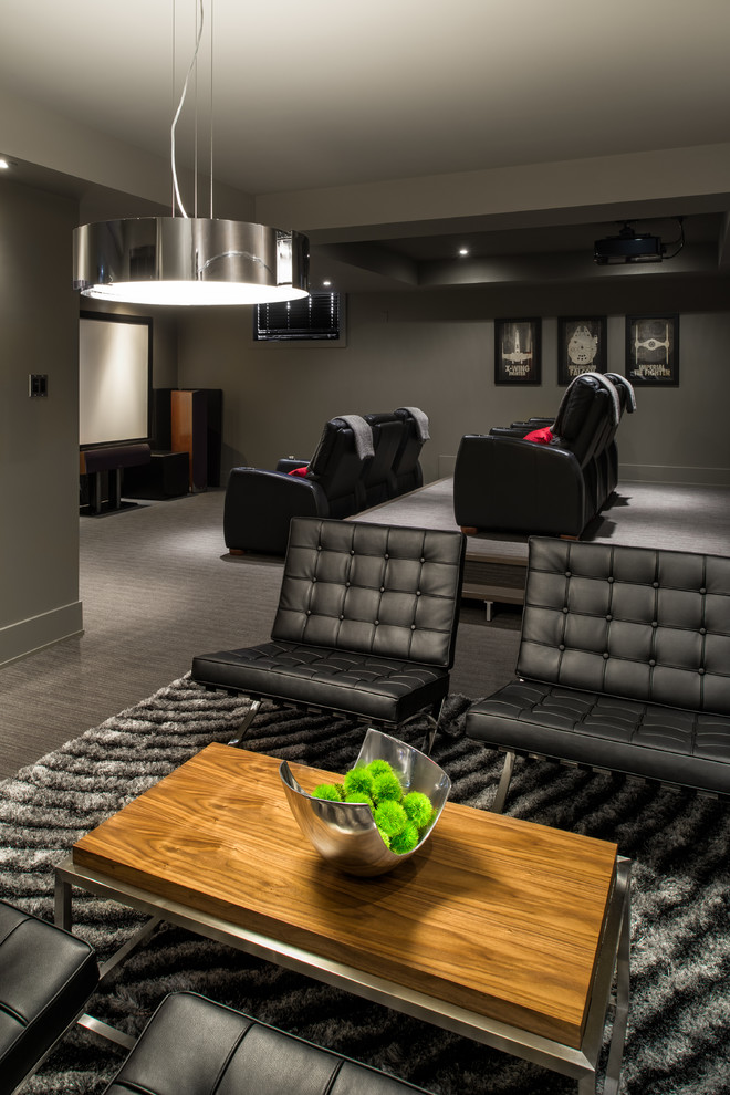 Inspiration for a contemporary home theatre in Ottawa with grey walls and grey floor.
