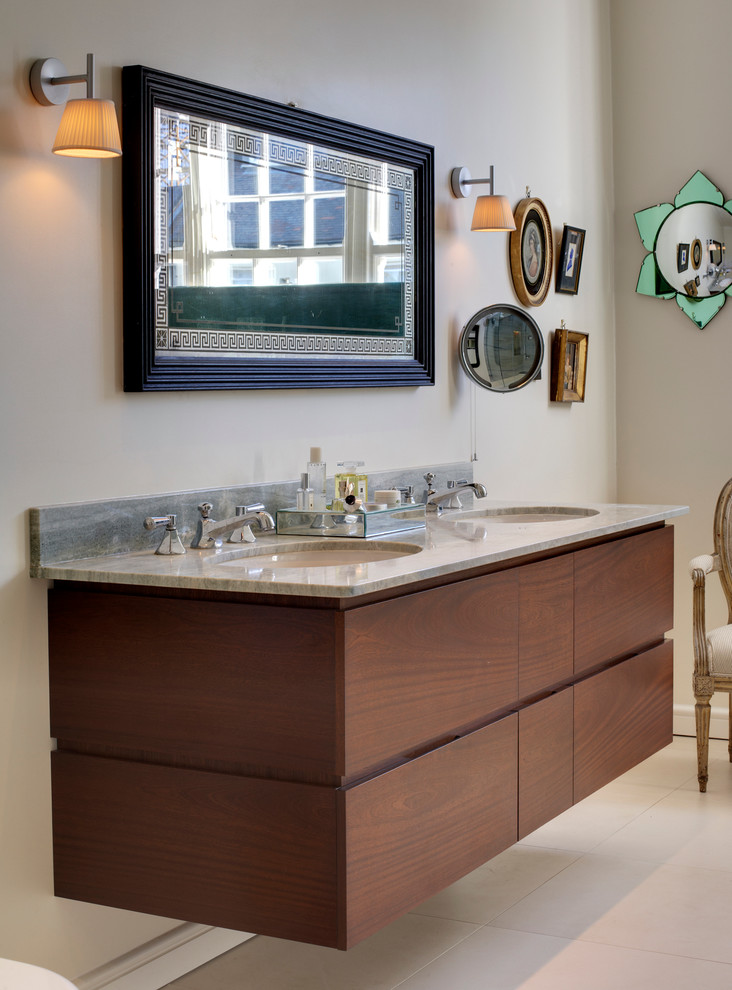 Design ideas for a mid-sized eclectic master bathroom in London with an undermount sink, flat-panel cabinets, dark wood cabinets, white walls, marble benchtops, gray tile, stone slab and ceramic floors.