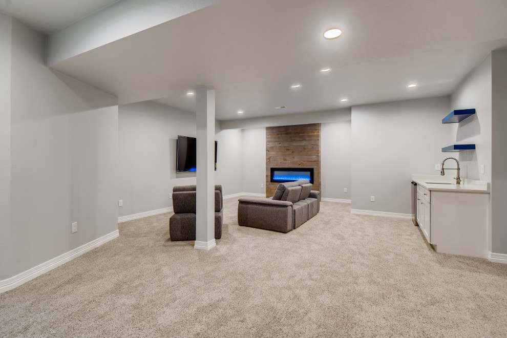 Mid-sized contemporary fully buried basement in Denver with grey walls, carpet and grey floor.