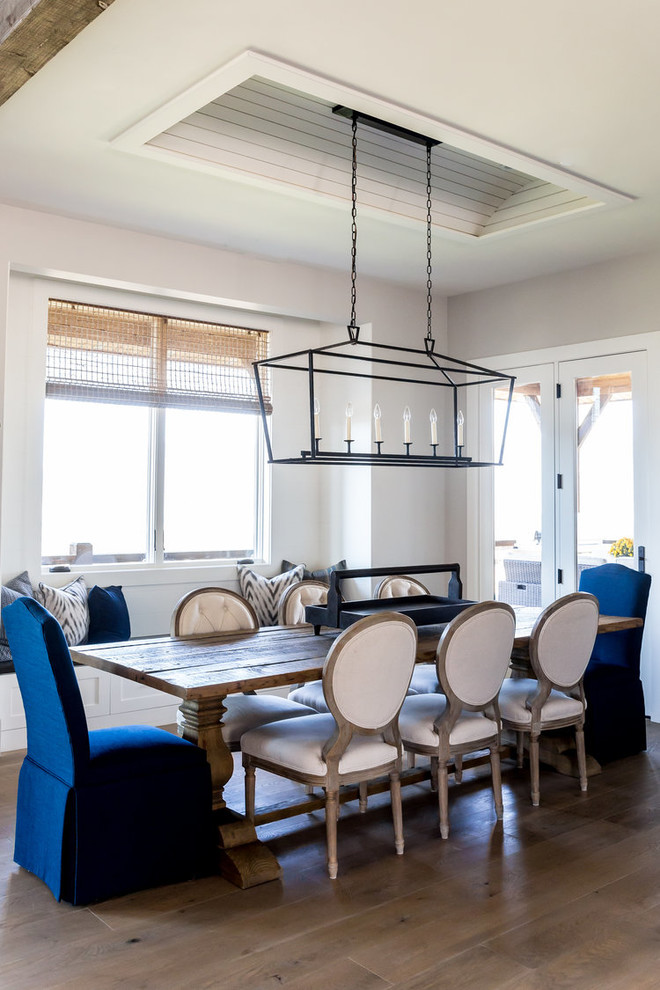 Kitchen/dining room combo - mid-sized transitional medium tone wood floor and beige floor kitchen/dining room combo idea in Phoenix with white walls