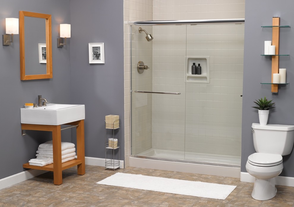 This is an example of a mid-sized 3/4 bathroom in Austin with a corner shower, a two-piece toilet, gray tile, subway tile, purple walls, porcelain floors, a console sink, brown floor and a sliding shower screen.