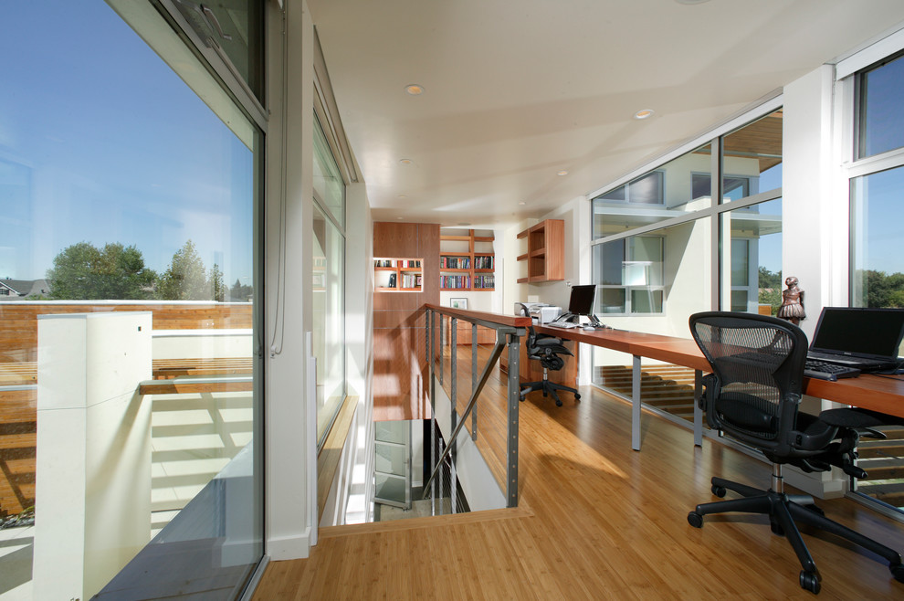 Inspiration for a contemporary home office in Sacramento with bamboo floors.