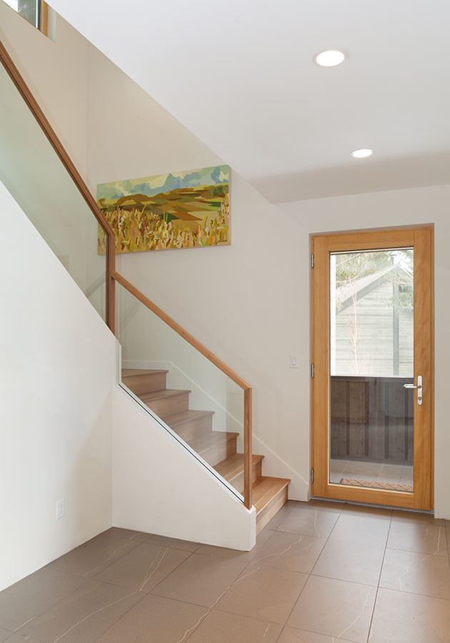 Mid-sized contemporary foyer in Vancouver with white walls, ceramic floors, a single front door and a glass front door.