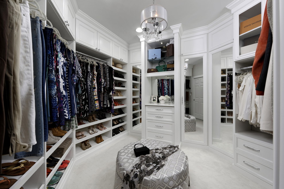 Example of a mid-sized transitional women's walk-in closet design in DC Metro