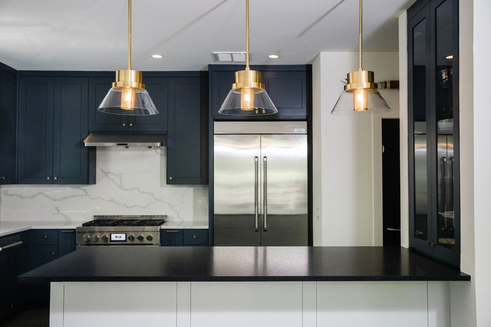 Eat-in kitchen - mid-sized transitional l-shaped cement tile floor and gray floor eat-in kitchen idea in Austin with an undermount sink, flat-panel cabinets, blue cabinets, quartz countertops, white backsplash, stainless steel appliances, an island and white countertops