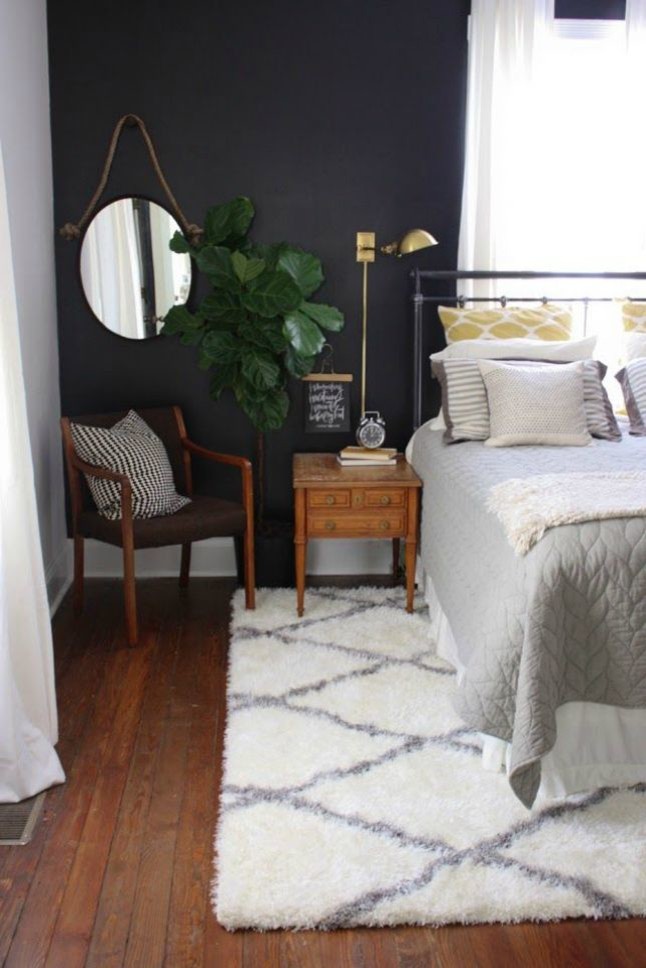 Inspiration for a mid-sized transitional bedroom in Los Angeles with grey walls, medium hardwood floors, no fireplace and brown floor.