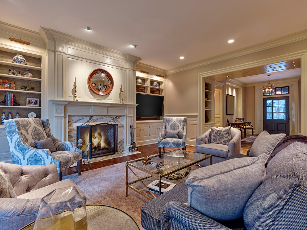 Photo of a large traditional formal open concept living room in Philadelphia with beige walls, medium hardwood floors, a standard fireplace, a stone fireplace surround and a built-in media wall.