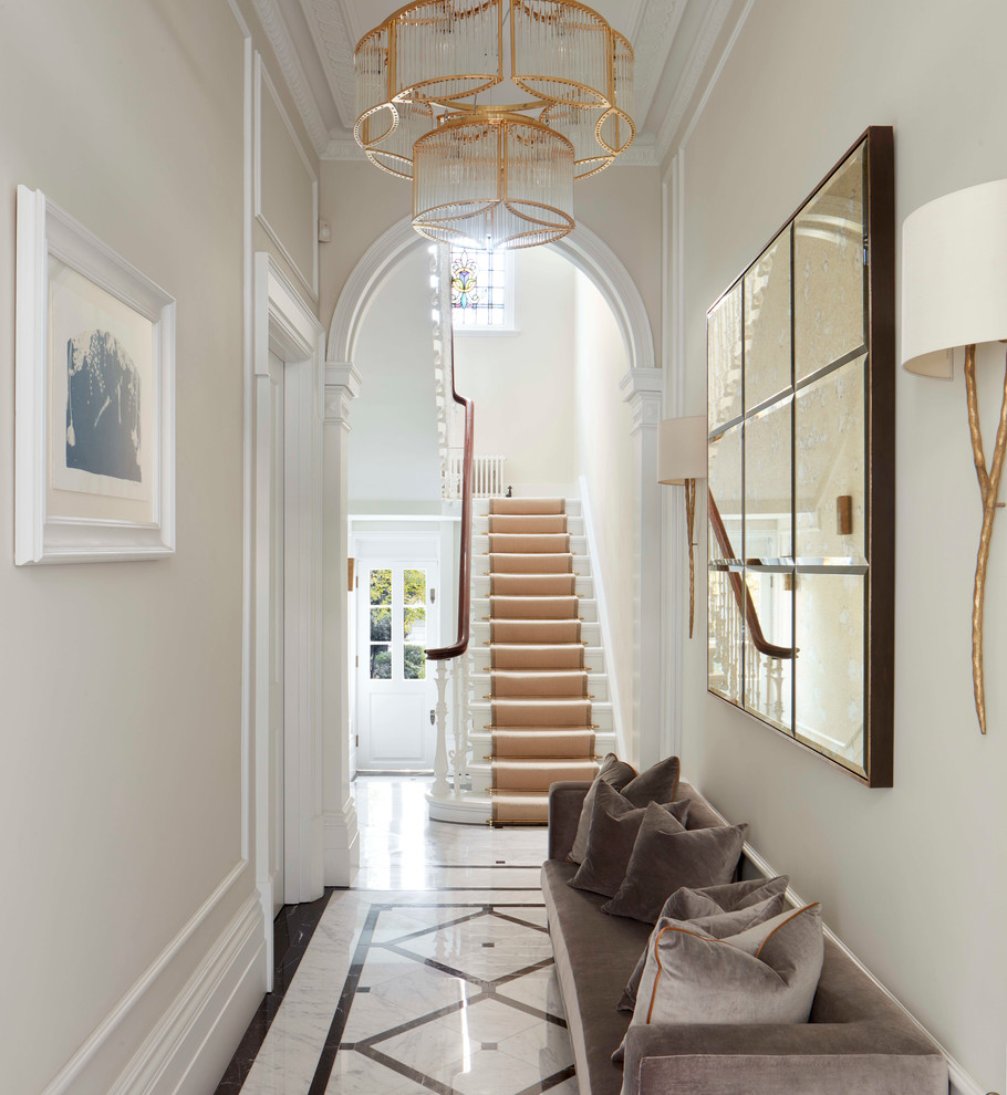 Inspiration for a traditional hallway in London with beige walls.
