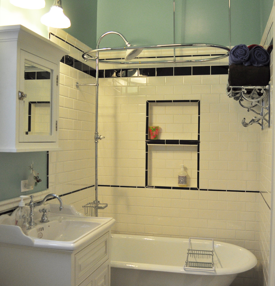 Design ideas for a small traditional master bathroom in San Francisco with raised-panel cabinets, white cabinets, a claw-foot tub, a two-piece toilet, black and white tile, subway tile, blue walls, porcelain floors and an integrated sink.