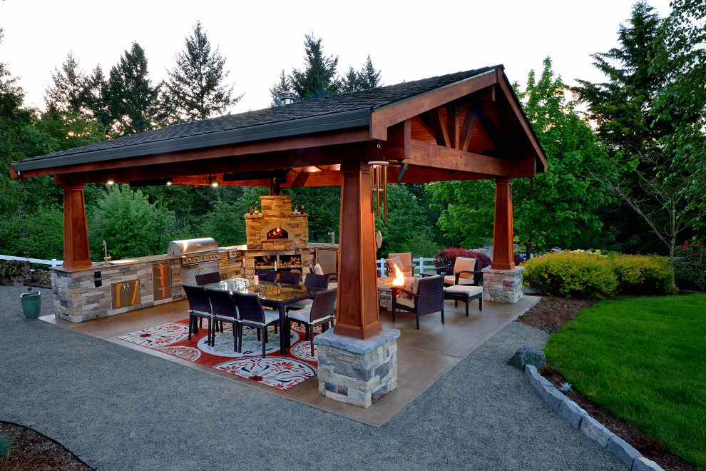 Inspiration for a large country backyard patio in Portland with tile and a gazebo/cabana.