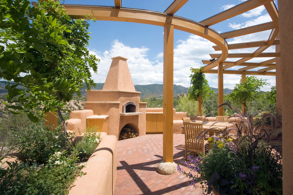Inspiration for a patio in Albuquerque with a pergola and a fire feature.
