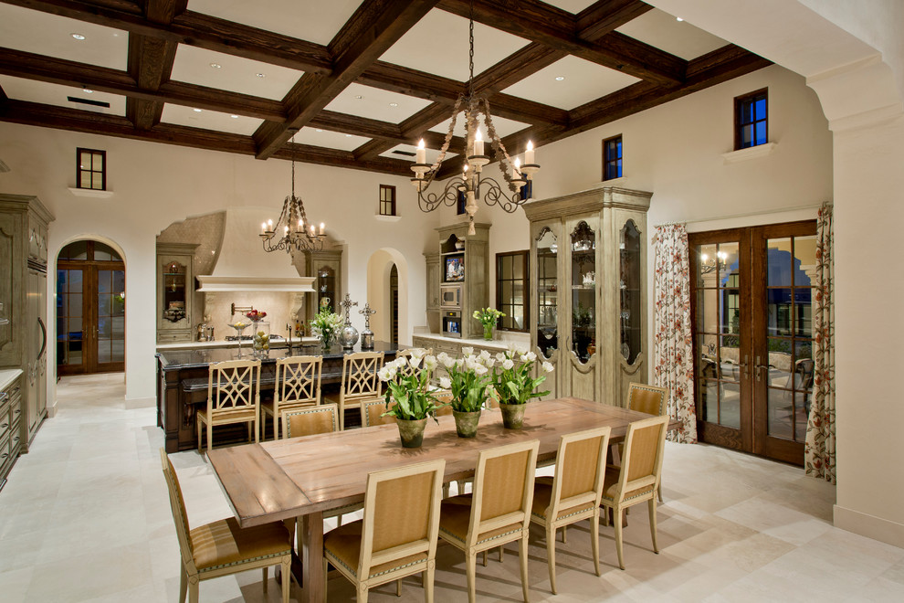 Inspiration for a mediterranean dining room in Phoenix with white walls, travertine floors and beige floor.