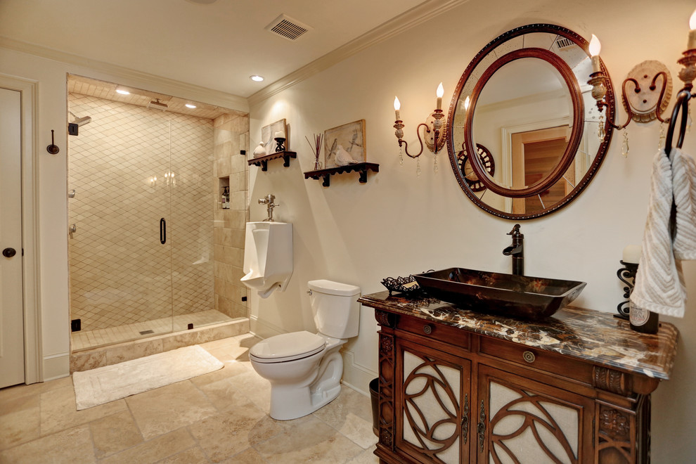 Photo of a mid-sized traditional wet room bathroom in Atlanta with beaded inset cabinets, brown cabinets, an urinal, grey walls, travertine floors, with a sauna, a vessel sink, onyx benchtops, brown floor and a hinged shower door.