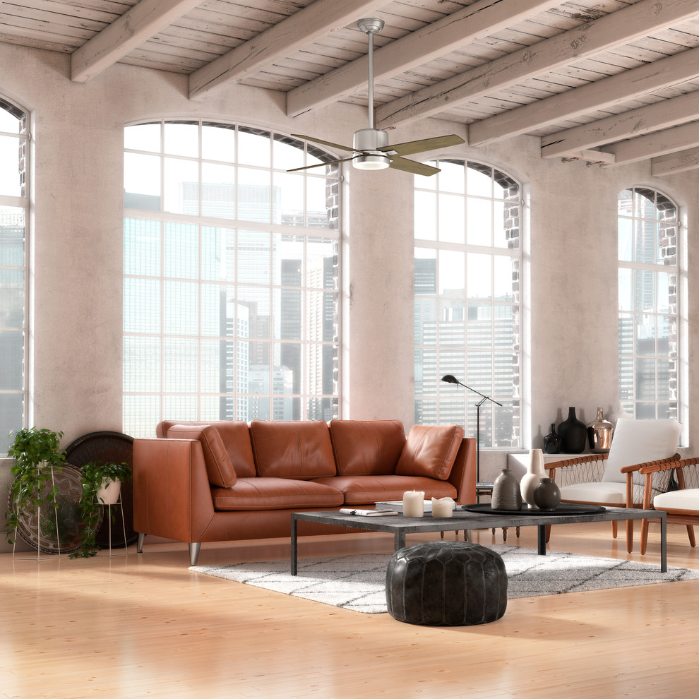 Inspiration for an expansive industrial loft-style living room in New York with white walls, light hardwood floors, no fireplace and no tv.