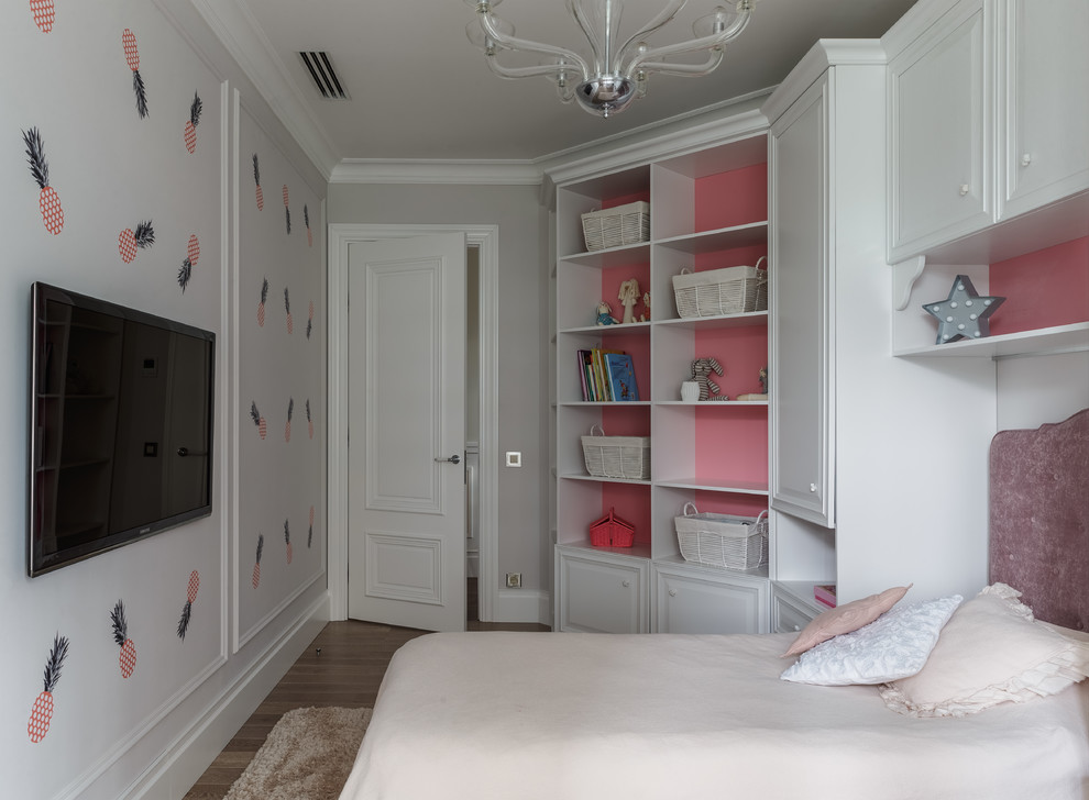 This is an example of a transitional kids' room for girls in Other with white walls.